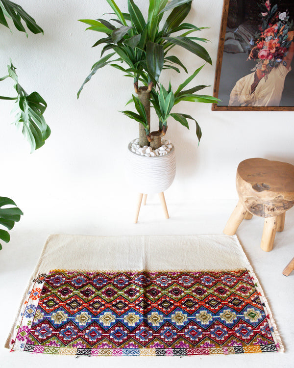 Vintage mini kilim rug in room decor setting, kilim, Turkish rug, vintage rug, portland, rug shop, bright colors, wild shaman, soft rug, bold color, Portland, Oregon, rug store, rug shop, local shop