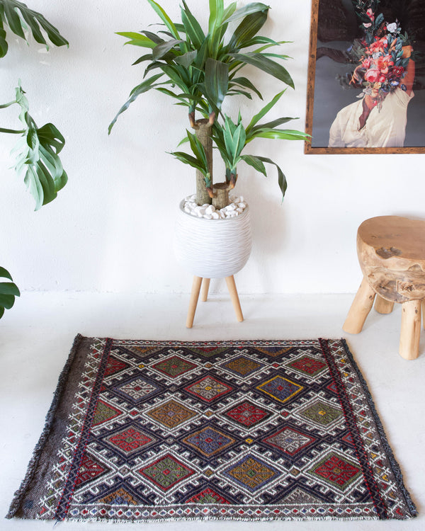 Vintage mini kilim rug in room decor setting, kilim, Turkish rug, vintage rug, portland, rug shop, bright colors, wild shaman, soft rug, bold color, Portland, Oregon, rug store, rug shop, local shop