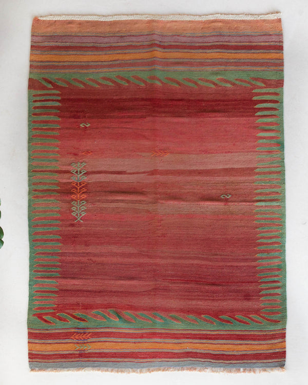 Vintage kilim rug in room decor setting, old rug, antique rug, pastel colors, faded colors, Turkish rug, vintage rug, soft rug, Portland, Oregon, rug store, rug shop, local shop, bold colors, bright colors, faded colors