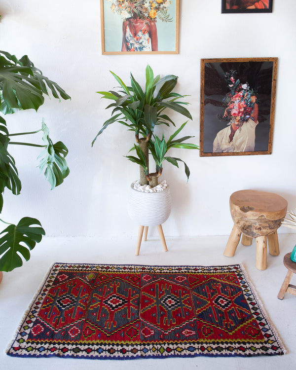 Vintage mini kilim rug in room decor setting, kilim, Turkish rug, vintage rug, portland, rug shop, bright colors, wild shaman, soft rug, bold color, Portland, Oregon, rug store, rug shop, local shop