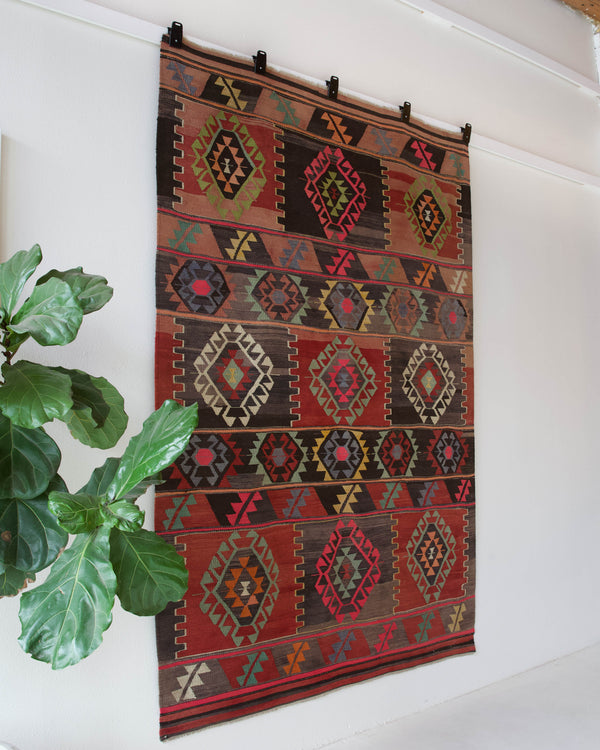 Vintage kilim rug in living room setting, bright colors, wild shaman, soft rug, bold color, Portland, Oregon, rug store, rug shop, local shop, vintage rug, modern kilim, warm colors