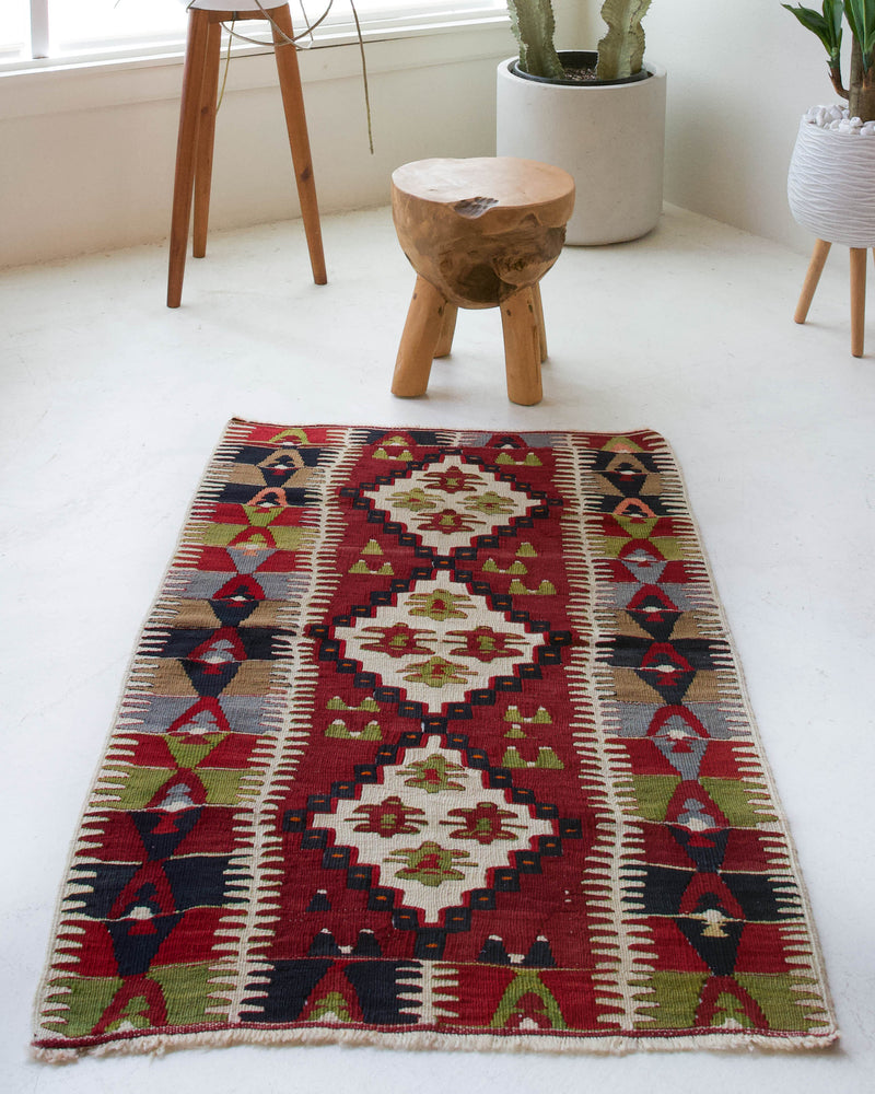 Vintage mini kilim rug in room decor setting, kilim, Turkish rug, vintage rug, portland, rug shop, bright colors, wild shaman, soft rug, bold color, Portland, Oregon, rug store, rug shop, local shop