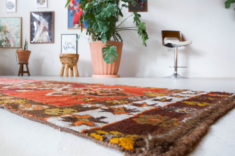 Vintage Turkish runner rug in a living room setting, pile rug, Turkish rug, vintage rug, portland, rug shop, bright colors, wild shaman, soft rug, bold color, Portland, Oregon, rug store, rug shop, local shop, antique rug