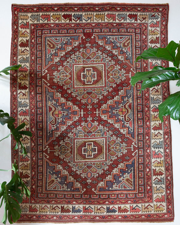 Vintage Turkish rug in living room setting, old rug, antique rug, pastel colors, faded colors, Turkish rug, vintage rug, soft rug, Portland, Oregon, rug store, rug shop, local shop