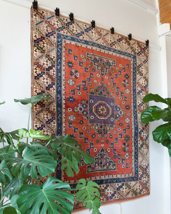 Vintage Turkish rug in living room setting, old rug, antique rug, pastel colors, faded colors, Turkish rug, vintage rug, soft rug, Portland, Oregon, rug store, rug shop, local shop