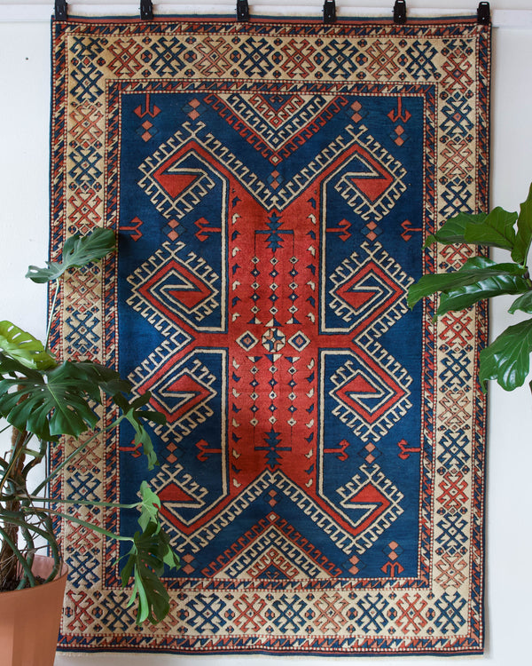 Vintage Turkish rug in a living room setting, pile rug, Turkish rug, vintage rug, portland, rug shop, bright colors, wild shaman, soft rug, bold color, Portland, Oregon, rug store, rug shop, local shop, antique rug