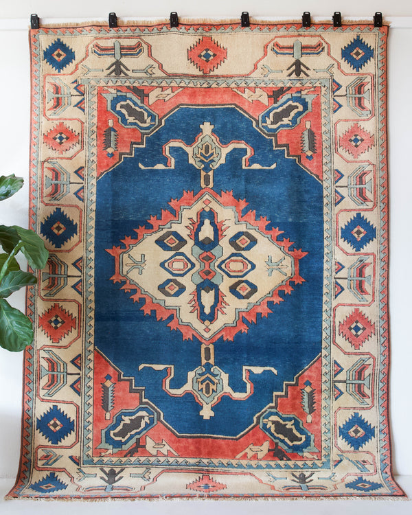 Vintage Turkish rug in living room setting, old rug, antique rug, pastel colors, faded colors, Turkish rug, vintage rug, soft rug, Portland, Oregon, rug store, rug shop, local shop