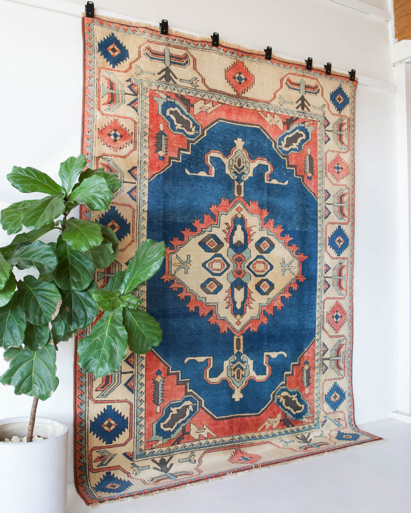 Vintage Turkish rug in living room setting, old rug, antique rug, pastel colors, faded colors, Turkish rug, vintage rug, soft rug, Portland, Oregon, rug store, rug shop, local shop