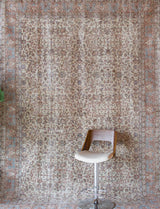 Area rug in a living room setting, pile rug, Turkish rug, old rug, antique rug, pastel colors, faded colors, Turkish rug, vintage rug, soft rug, Portland, Oregon, rug store, rug shop, local shop, distressed rug, worn out rug