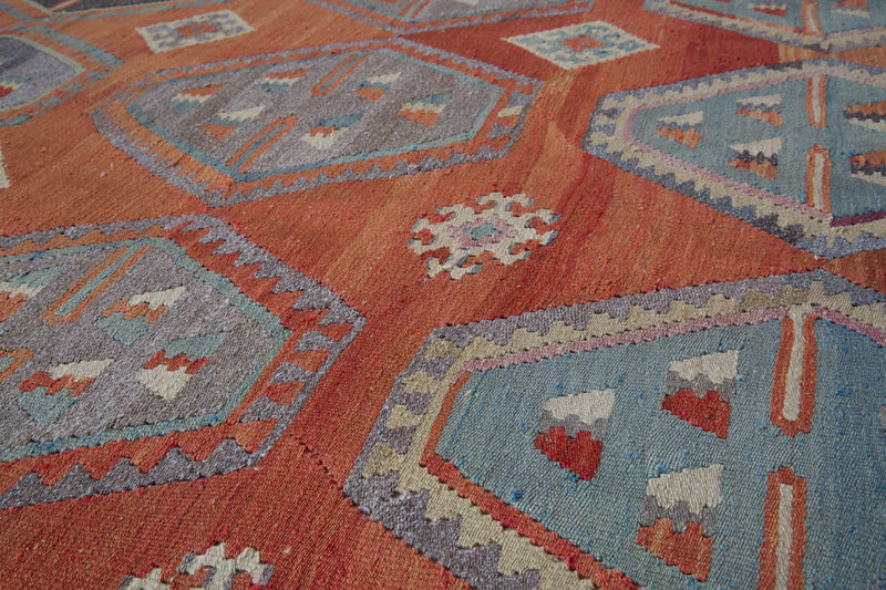 Vintage kilim rug in room decor setting, old rug, antique rug, pastel colors, faded colors, Turkish rug, vintage rug, soft rug, Portland, Oregon, rug store, rug shop, local shop, bold colors, bright colors, faded colors