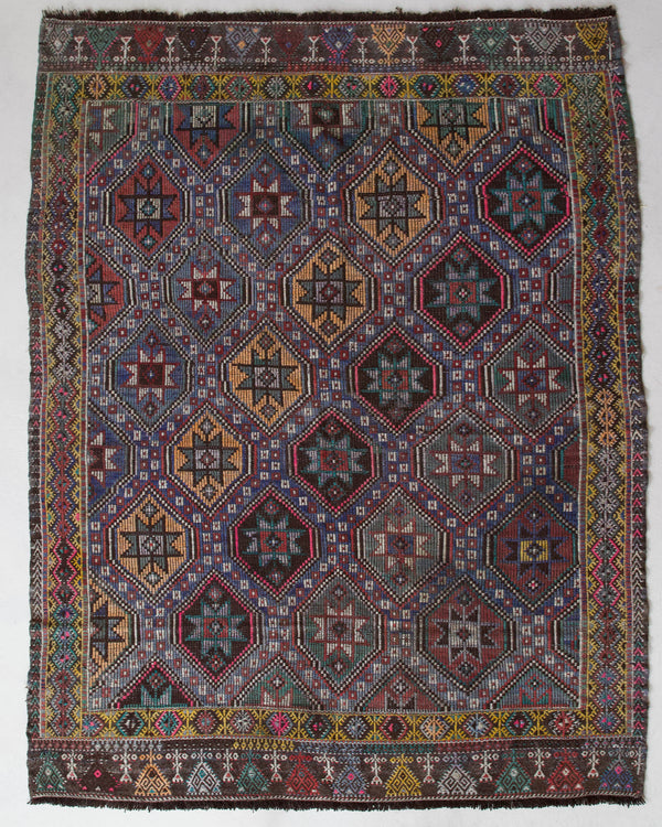 Vintage kilim rug in room decor setting, old rug, antique rug, pastel colors, faded colors, Turkish rug, vintage rug, soft rug, Portland, Oregon, rug store, rug shop, local shop, bold colors, bright colors, faded colors