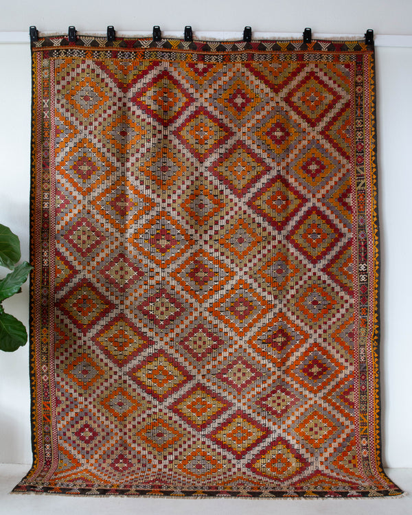 Vintage kilim rug in room decor setting, old rug, antique rug, pastel colors, faded colors, Turkish rug, vintage rug, soft rug, Portland, Oregon, rug store, rug shop, local shop, bold colors, bright colors, faded colors