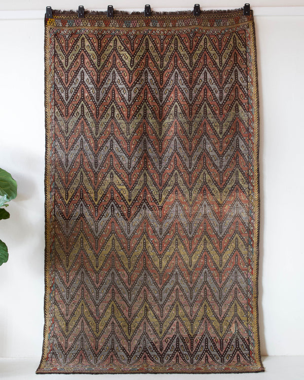 Vintage kilim rug in room decor setting, old rug, antique rug, pastel colors, faded colors, Turkish rug, vintage rug, soft rug, Portland, Oregon, rug store, rug shop, local shop, bold colors, bright colors, faded colors