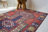 Vintage Turkish rug in living room setting, old rug, antique rug, pastel colors, faded colors, Turkish rug, vintage rug, soft rug, Portland, Oregon, rug store, rug shop, local shop