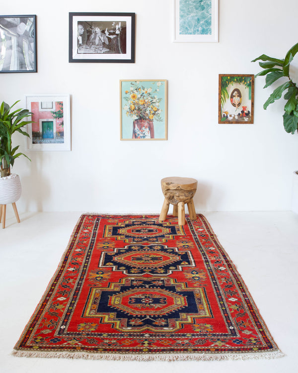 Vintage caucasian rug in a living room setting, pile rug, Turkish rug, vintage rug, portland, rug shop, bright colors, wild shaman, soft rug, bold color, Portland, Oregon, rug store, rug shop, local shop, soft rug, pastel colors, faded colors