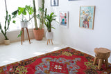  Vintage Turkish rug in a living room setting, pile rug, Turkish rug, vintage rug, portland, rug shop, bright colors, wild shaman, soft rug, bold color, Portland, Oregon, rug store, rug shop, local shop, antique rug