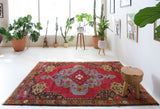 Vintage Turkish rug in a living room setting, pile rug, Turkish rug, vintage rug, portland, rug shop, bright colors, wild shaman, soft rug, bold color, Portland, Oregon, rug store, rug shop, local shop, antique rug