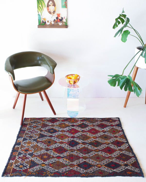 Vintage mini kilim rug in room decor setting, kilim, Turkish rug, vintage rug, portland, rug shop, bright colors, wild shaman, soft rug, bold color, Portland, Oregon, rug store, rug shop, local shop