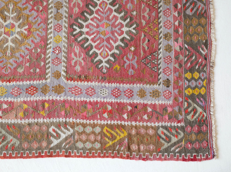  Vintage kilim rug in room decor setting, old rug, antique rug, pastel colors, faded colors, Turkish rug, vintage rug, soft rug, Portland, Oregon, rug store, rug shop, local shop, distressed rug, worn out rug