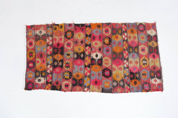 Vintage kilim rug in room decor setting, old rug, antique rug, pastel colors, faded colors, Turkish rug, vintage rug, soft rug, Portland, Oregon, rug store, rug shop, local shop