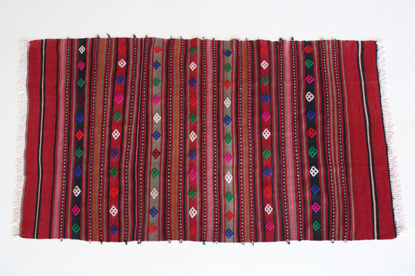 Vintage mini kilim rug in room decor setting, kilim, Turkish rug, vintage rug, portland, rug shop, bright colors, wild shaman, soft rug, bold color, Portland, Oregon, rug store, rug shop, local shop