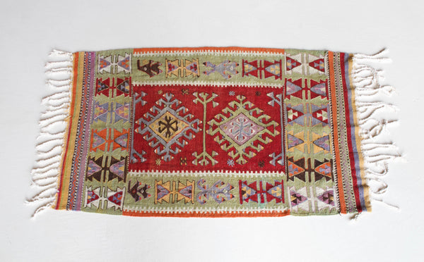 Vintage kilim rug in room decor setting, kilim, Turkish rug, vintage rug, portland, rug shop, bright colors, wild shaman, soft rug, bold color, Portland, Oregon, rug store, rug shop, local shop, antique rug