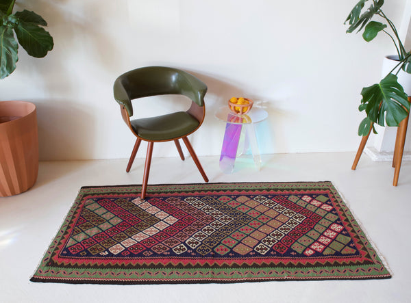 Vintage kilim rug in room decor setting, kilim, Turkish rug, vintage rug, portland, rug shop, bright colors, wild shaman, soft rug, bold color, Portland, Oregon, rug store, rug shop, local shop, antique rug