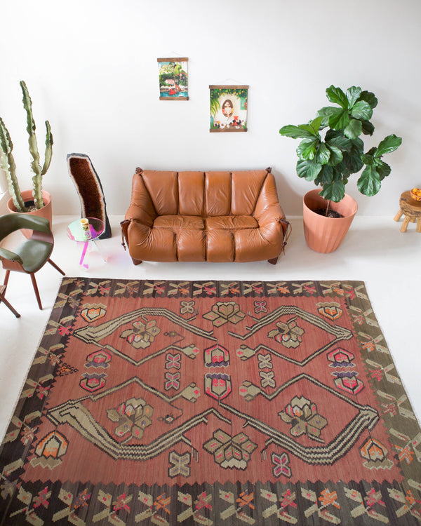 Vintage kilim rug in living room setting, old rug, antique rug, pastel colors, faded colors, Turkish rug, vintage rug, soft rug, Portland, Oregon, rug store, rug shop, local shop