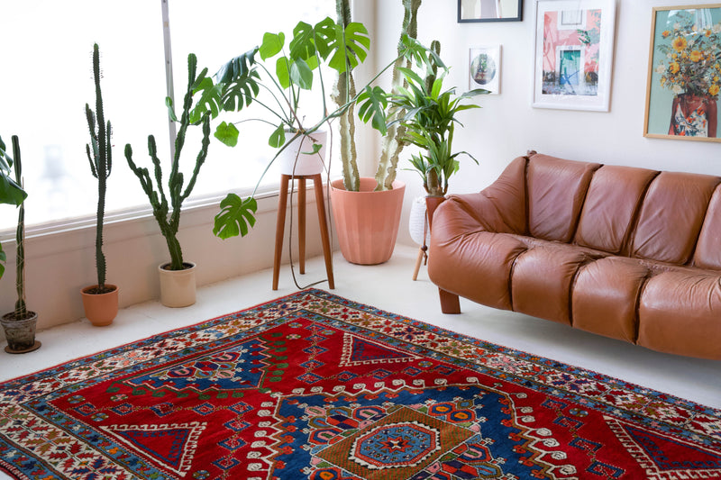 Vintage Turkish rug in a living room setting, pile rug, Turkish rug, vintage rug, portland, rug shop, bright colors, wild shaman, soft rug, bold color, Portland, Oregon, rug store, rug shop, local shop, antique rug