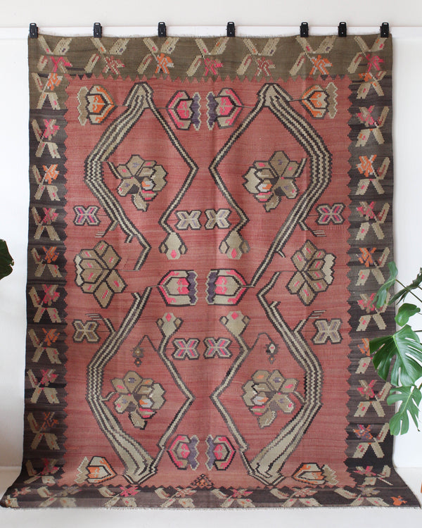 Vintage kilim rug in living room setting, old rug, antique rug, pastel colors, faded colors, Turkish rug, vintage rug, soft rug, Portland, Oregon, rug store, rug shop, local shop