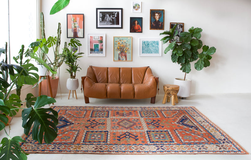 Vintage Turkish rug in living room setting, old rug, antique rug, pastel colors, faded colors, Turkish rug, vintage rug, soft rug, Portland, Oregon, rug store, rug shop, local shop