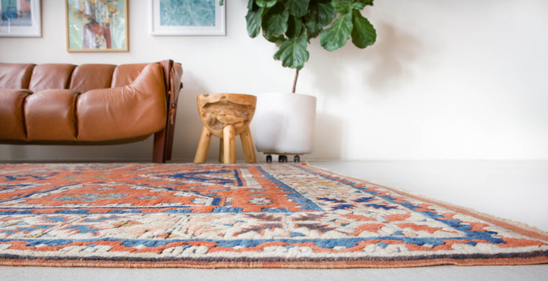 Vintage Turkish rug in living room setting, old rug, antique rug, pastel colors, faded colors, Turkish rug, vintage rug, soft rug, Portland, Oregon, rug store, rug shop, local shop