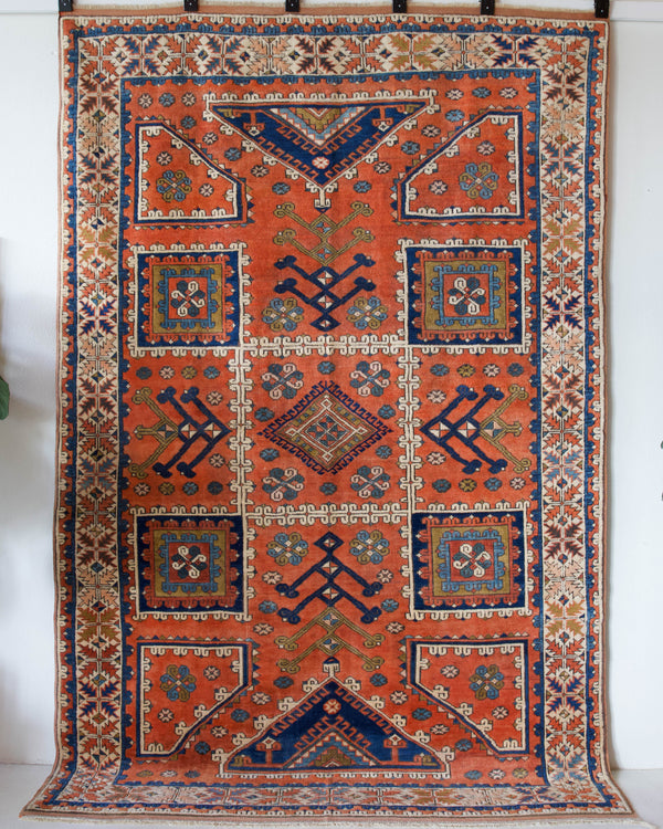 Vintage Turkish rug in living room setting, old rug, antique rug, pastel colors, faded colors, Turkish rug, vintage rug, soft rug, Portland, Oregon, rug store, rug shop, local shop