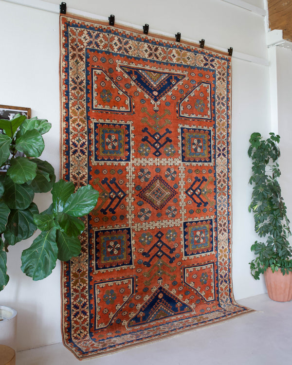 Vintage Turkish rug in living room setting, old rug, antique rug, pastel colors, faded colors, Turkish rug, vintage rug, soft rug, Portland, Oregon, rug store, rug shop, local shop