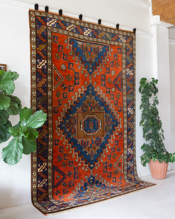 Vintage Turkish rug in a living room setting, pile rug, Turkish rug, vintage rug, portland, rug shop, bright colors, wild shaman, soft rug, bold color, Portland, Oregon, rug store, rug shop, local shop, antique rug