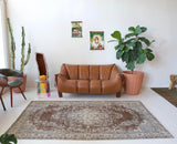 Vintage Turkish rug in living room setting, old rug, antique rug, pastel colors, faded colors, Turkish rug, vintage rug, distressed rug, worn out rug, Portland, Oregon, rug store, rug shop, local shop