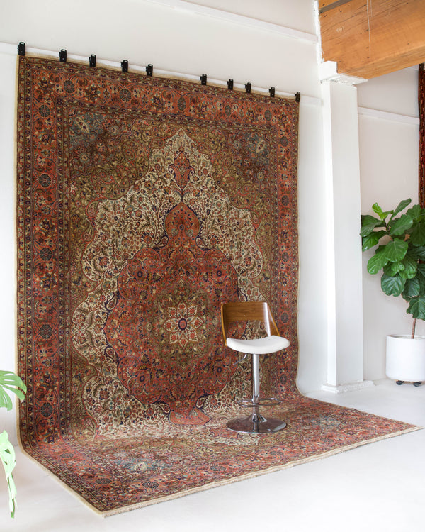 Area rug in a living room setting, pile rug, Turkish rug, old rug, antique rug, pastel colors, faded colors, Turkish rug, vintage rug, soft rug, Portland, Oregon, rug store, rug shop, local shop