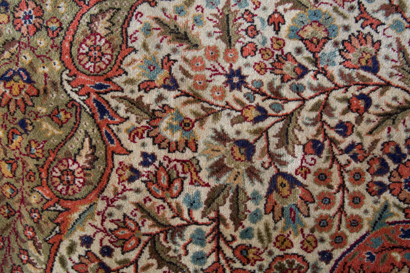 Area rug in a living room setting, pile rug, Turkish rug, old rug, antique rug, pastel colors, faded colors, Turkish rug, vintage rug, soft rug, Portland, Oregon, rug store, rug shop, local shop