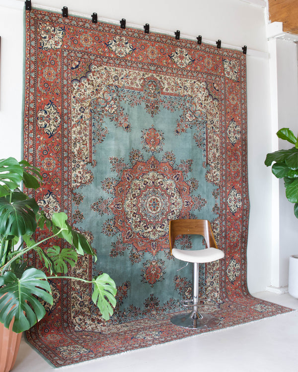 Area rug in a living room setting, pile rug, Turkish rug, old rug, antique rug, pastel colors, faded colors, Turkish rug, vintage rug, soft rug, Portland, Oregon, rug store, rug shop, local shop