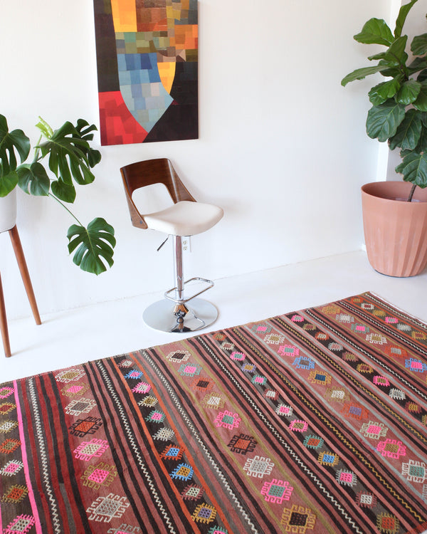 Vintage kilim rug in room decor setting, kilim, Turkish rug, vintage rug, portland, rug shop, bright colors, wild shaman, soft rug, bold color, Portland, Oregon, rug store, rug shop, local shop, antique rug