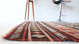 Vintage kilim rug in room decor setting, old rug, antique rug, pastel colors, faded colors, Turkish rug, vintage rug, soft rug, Portland, Oregon, rug store, rug shop, local shop