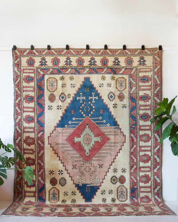 Vintage caucasian rug in a living room setting, pile rug, Turkish rug, vintage rug, portland, rug shop, bright colors, wild shaman, soft rug, bold color, Portland, Oregon, rug store, rug shop, local shop, soft rug, pastel colors, faded colors