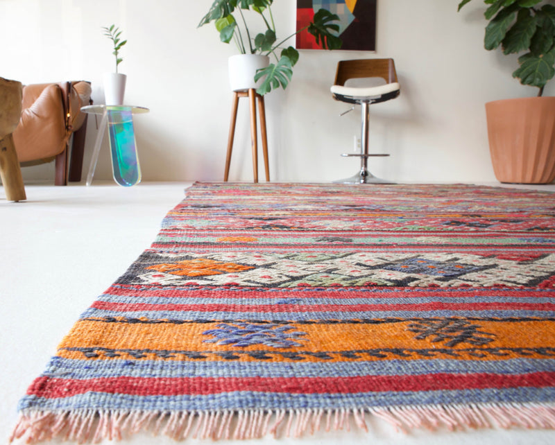  Vintage Turkish rug in a living room setting, pile rug, Turkish rug, vintage rug, portland, rug shop, bright colors, wild shaman, soft rug, bold color, Portland, Oregon, rug store, rug shop, local shop