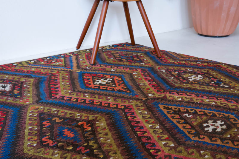 Vintage kilim rug in living room setting, bright colors, wild shaman, soft rug, bold color, Portland, Oregon, rug store, rug shop, local shop, vintage rug, modern kilim, warm colors