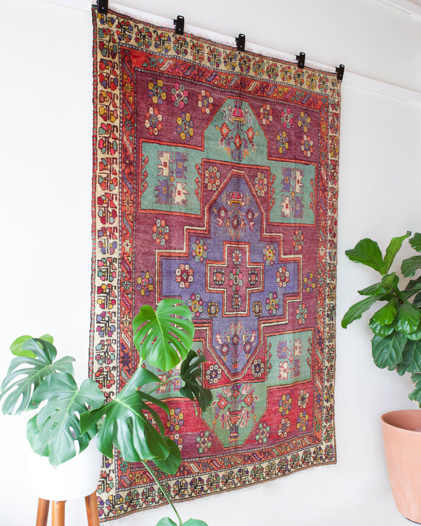 Vintage Turkish rug in living room setting, old rug, antique rug, pastel colors, faded colors, Turkish rug, vintage rug, soft rug, Portland, Oregon, rug store, rug shop, local shop