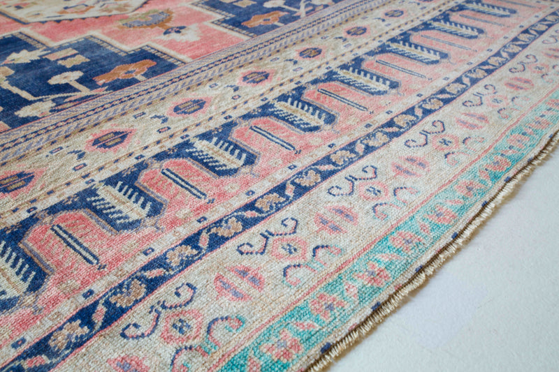Vintage Turkish rug in living room setting, old rug, antique rug, pastel colors, faded colors, Turkish rug, vintage rug, soft rug, Portland, Oregon, rug store, rug shop, local shop
