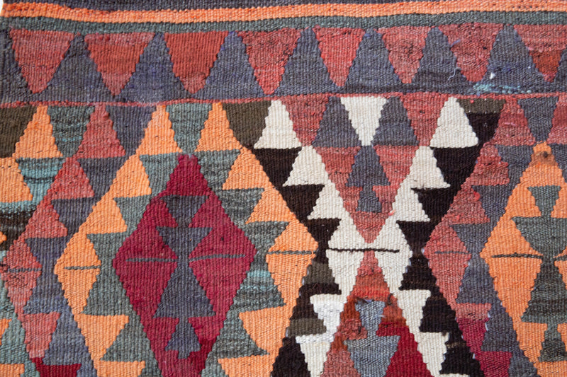  Vintage Turkish rug in a living room setting, pile rug, Turkish rug, vintage rug, portland, rug shop, bright colors, wild shaman, soft rug, bold color, Portland, Oregon, rug store, rug shop, local shop, antique rug