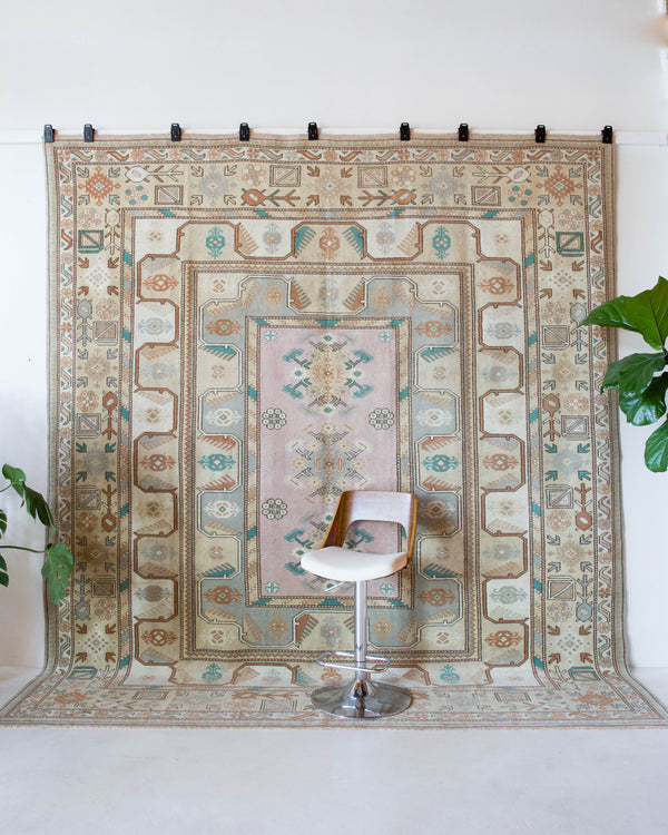 Vintage Turkish runner rug in living room setting, old rug, antique rug, pastel colors, faded colors, Turkish rug, vintage rug, soft rug, Portland, Oregon, rug store, rug shop, local shop