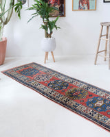 Vintage Turkish runner rug in living room setting, old rug, antique rug, pastel colors, faded colors, Turkish rug, vintage rug, soft rug, Portland, Oregon, rug store, rug shop, local shop