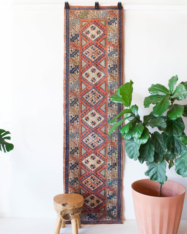 Vintage Turkish runner rug in living room setting, old rug, antique rug, pastel colors, faded colors, Turkish rug, vintage rug, soft rug, Portland, Oregon, rug store, rug shop, local shop